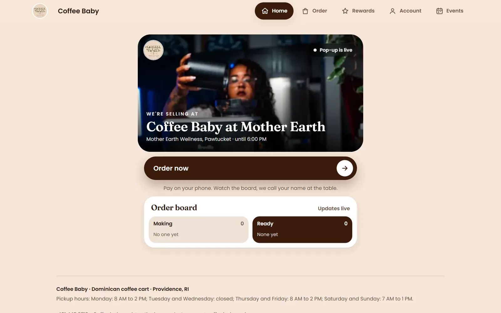 The Coffee Baby homepage on a laptop: a photo of a barista under the heading “Coffee Baby at Mother Earth”, an Order now button, and an order board showing orders being made and ready.